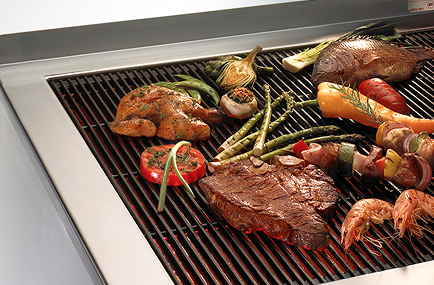 food cooking on a commercial wood grill