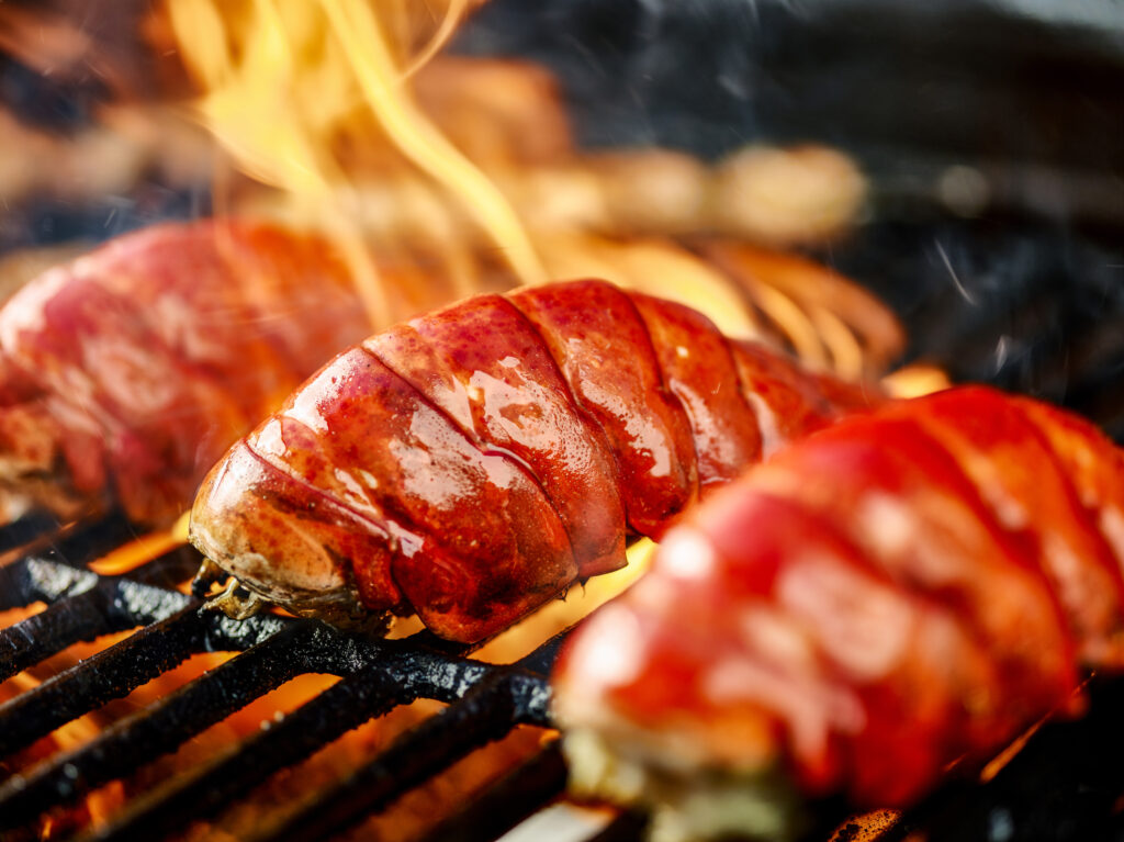 grilled lobster tail on a wood-fired grill