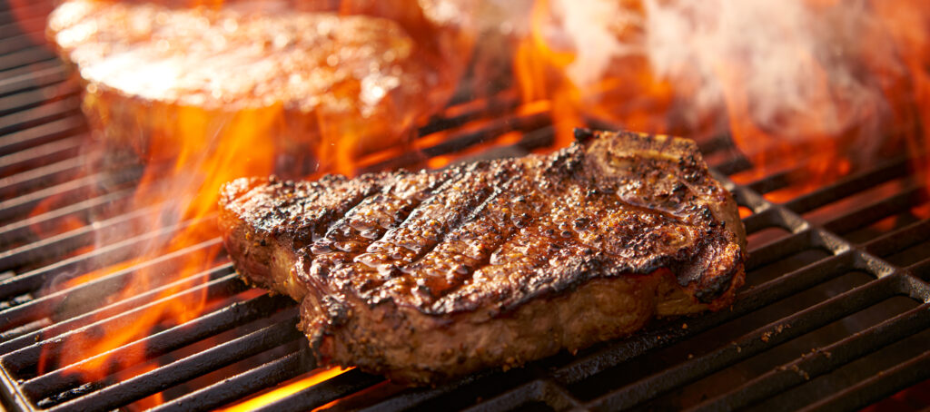 steak on wood fired grill