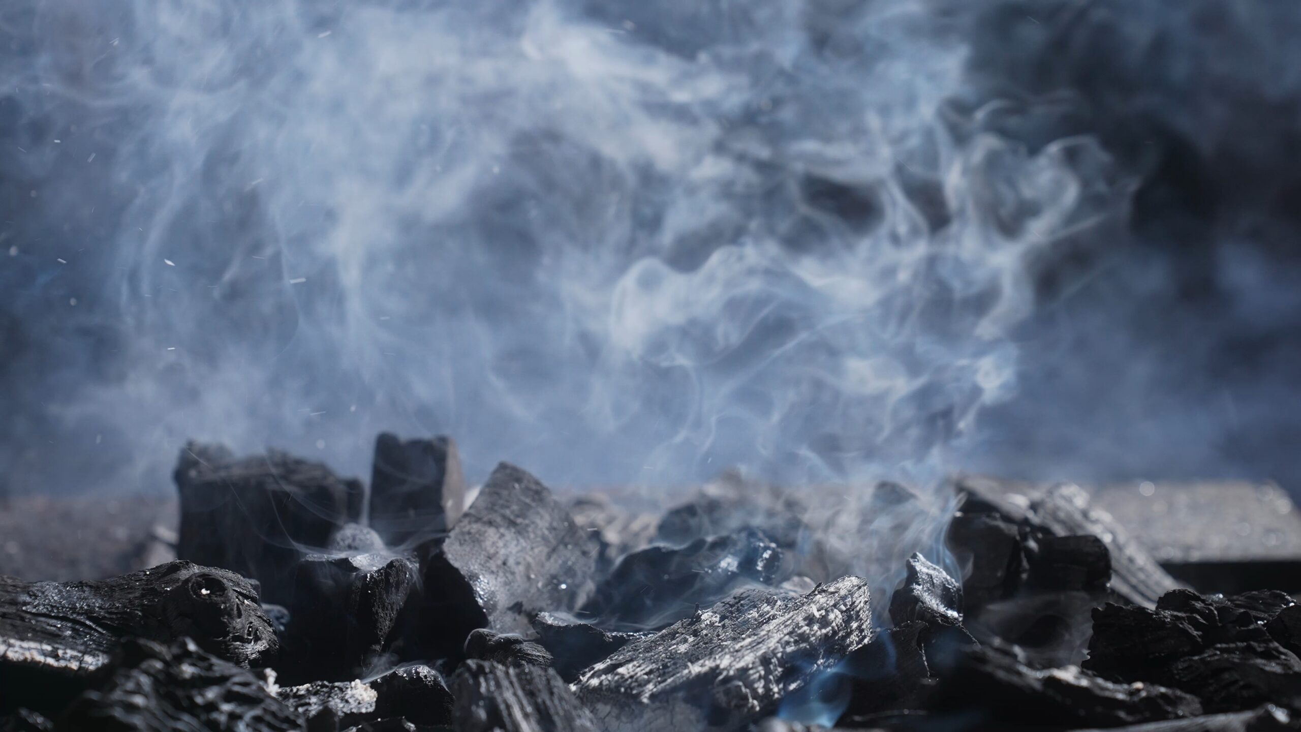 burnt wood chips from grill smoking and getting cleaned